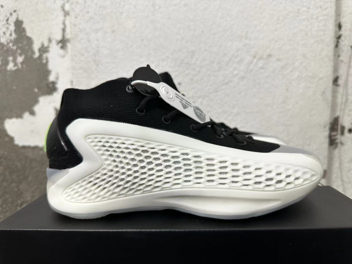 Side view showing the white textured side panel and black upper