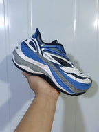 Balenciaga sneaker showing the layered upper, blue laces and sculpted gray-and-white sole.