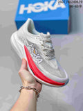 White Hoka One One MAFATE X shoe with red side and sole accents, shown against a blue shoe box.