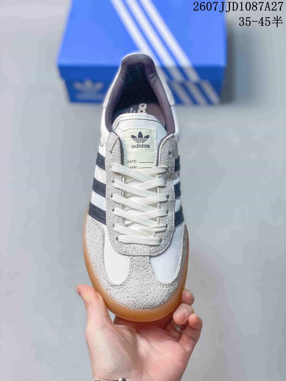 Top view showing the lace-up closure, white toe area, textured side panels and adidas tongue branding.