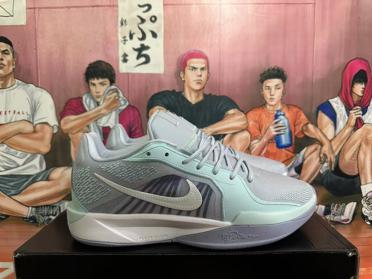 Side view of a light blue Nike basketball shoe with a contrasting Swoosh