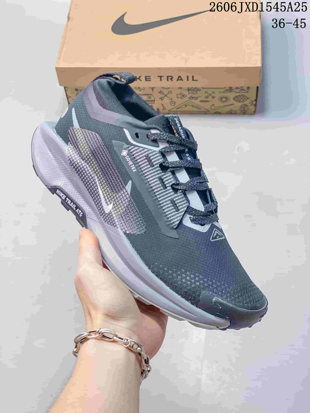 Angled side view of a Nike Pegasus Trail shoe with GORE-TEX branding
