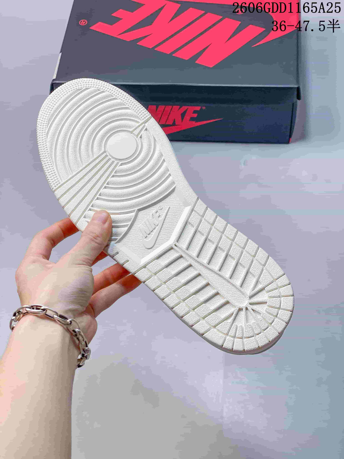 Underside of the white sneaker showing its molded outsole tread.