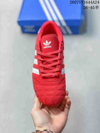 Top view of the red adidas sneaker showing the lace-up front, padded tongue, and adidas trefoil branding.