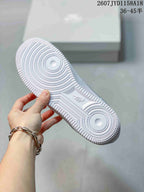Close view of the white textured outsole showing concentric traction circles and patterned tread.