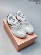 Pair of white and burgundy Miu Miu low-top sneakers displayed on a box, with style code 2607JYD625A15 and size range 36–45 visible above.