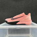 Side view of a pink Nike Precision 7 basketball shoe with a black Swoosh and outsole accents.