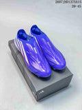 Pair of purple adidas F50 soccer cleats displayed on an adidas shoe box, with white stripes and translucent studded soles visible.