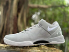 Angled view highlighting the upper, side logo, and outsole of a Wolf Grey Nike Kobe 8