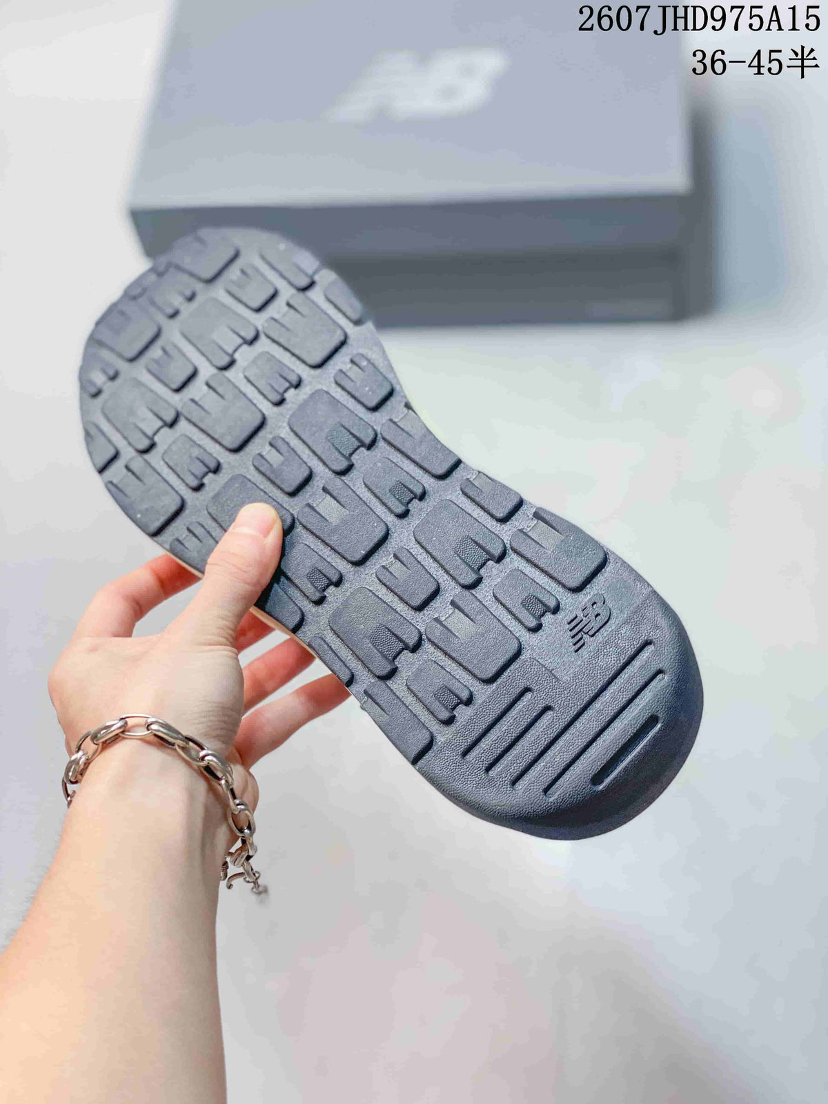 Close-up of the textured rubber outsole on a New Balance 5740 sneaker.
