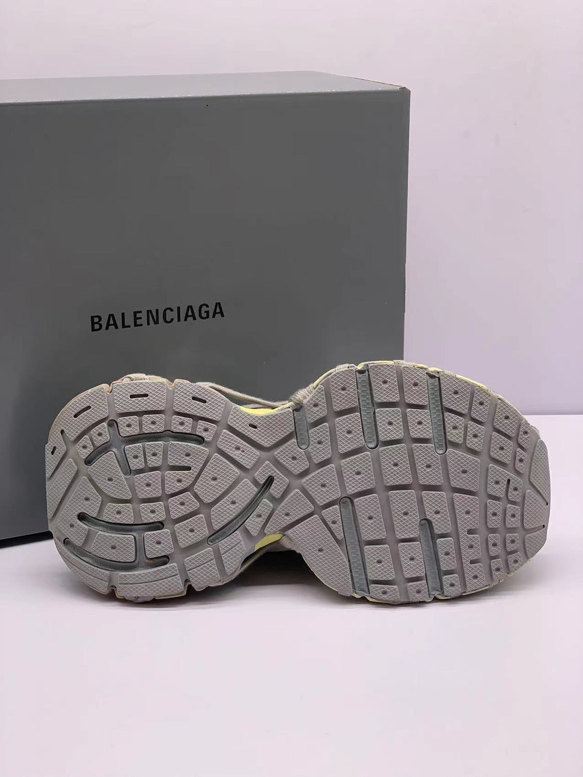 Underside view displaying the segmented rubber outsole and textured tread pattern.