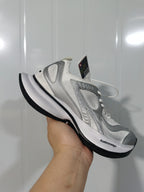 Angled view of the white and silver Balenciaga Circuit sneaker with visible Balenciaga branding on the midsole and tonal upper details.