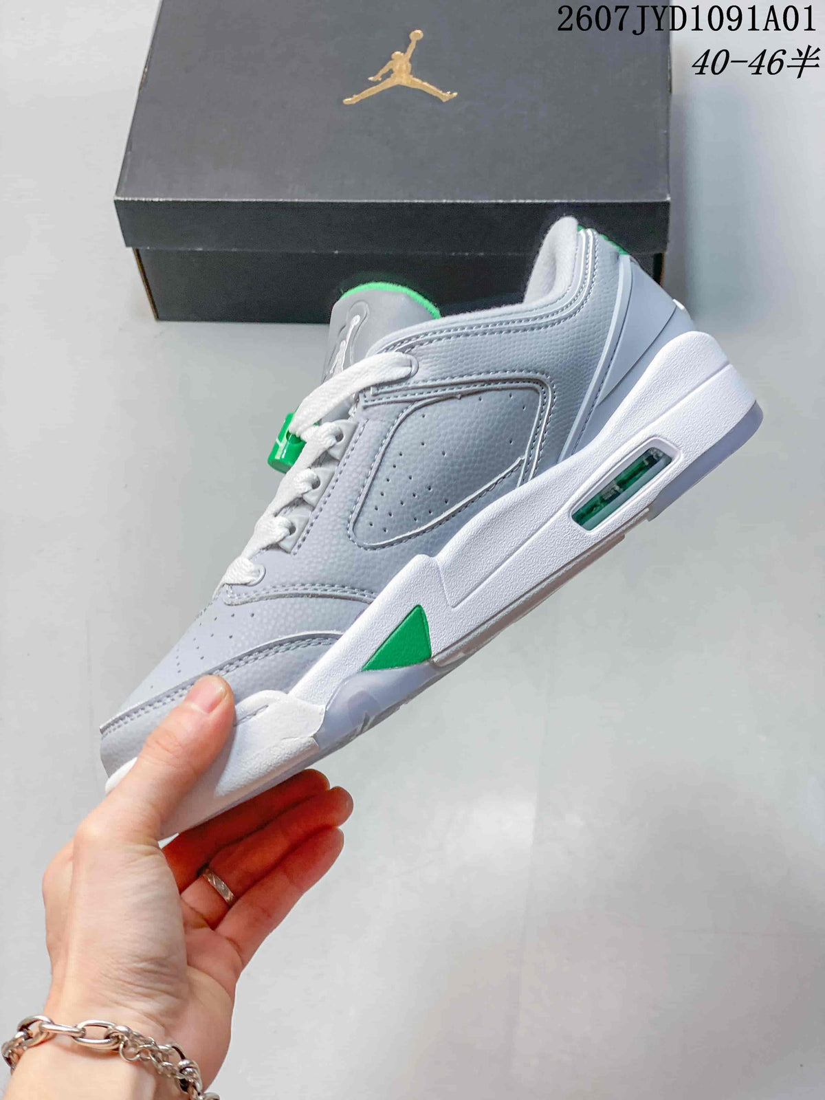 Side profile of the grey low-top sneaker with green accents and visible midsole window