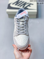 Top view showing the perforated toe box, patterned laces, tongue label, and collar.