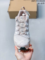 Top view of the white Salomon XA PRO 3D sneaker showing the tongue branding and cord-based quick-lace system.