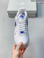 Front view showing white laces, perforated toe, and blue details