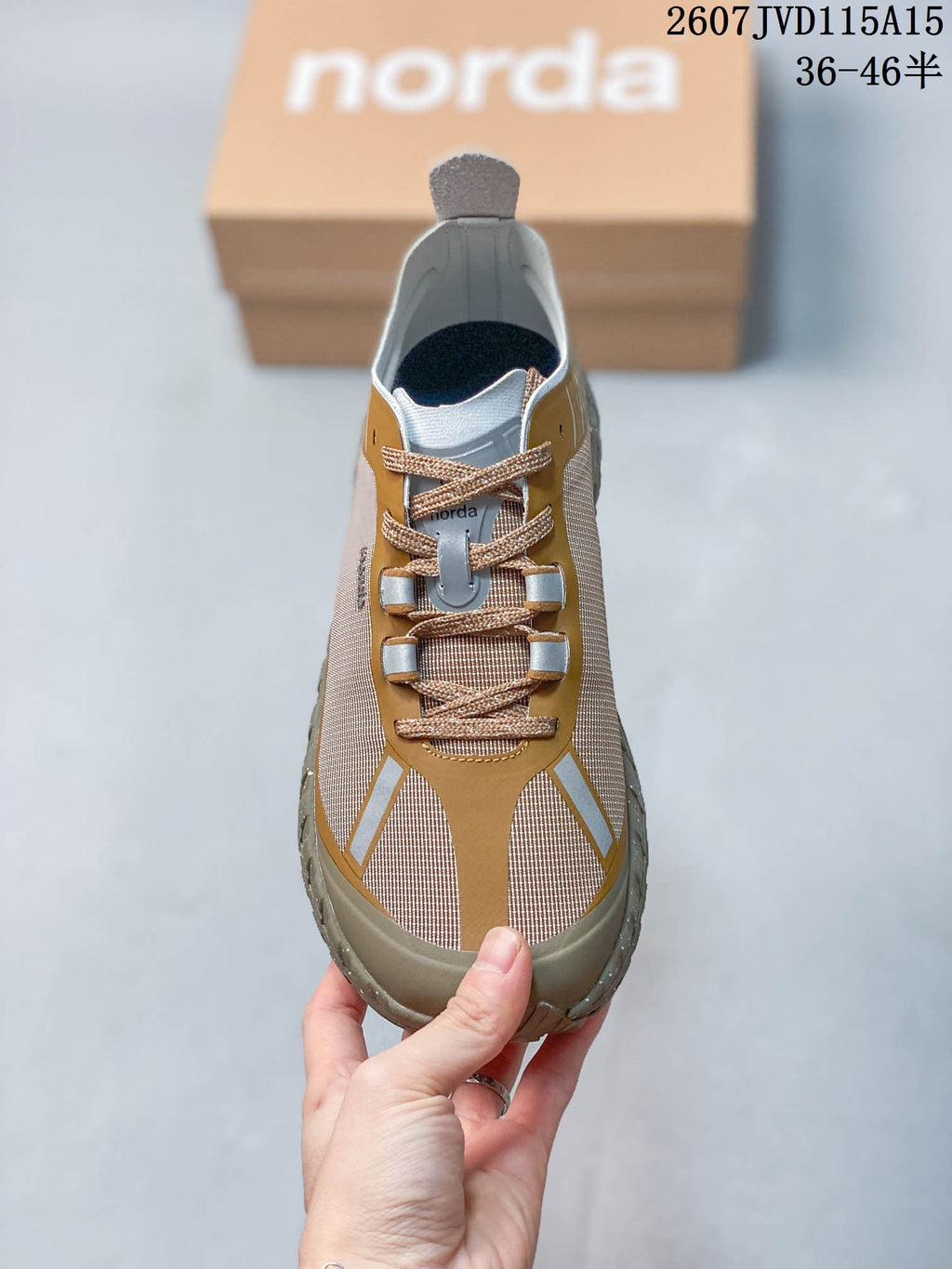 Top view of the sneaker showing the lace system, tongue, toe panels, and gray trim.