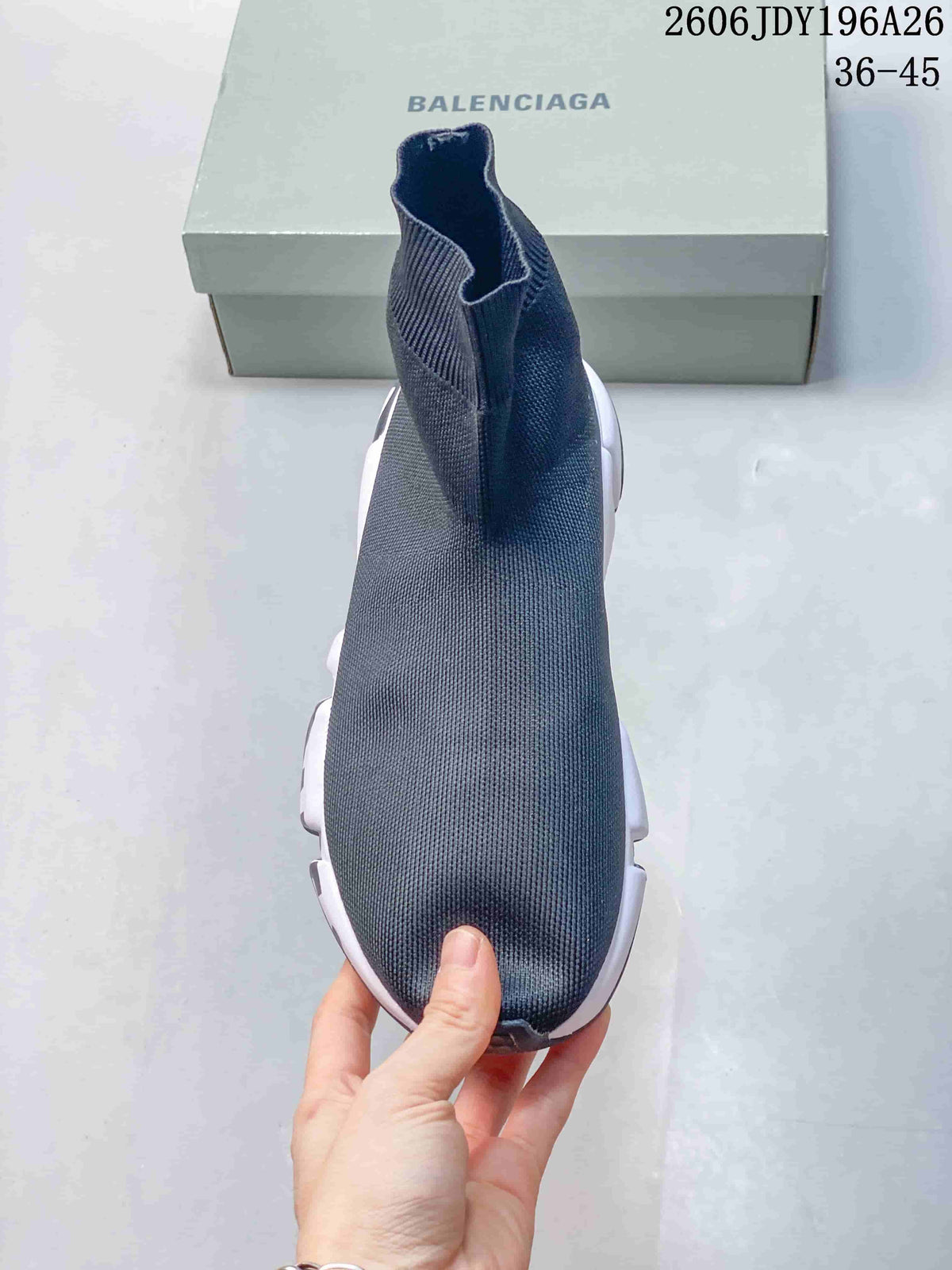 Top view of a dark gray sock-style sneaker showing the seamless-looking knit upper and high ankle collar.