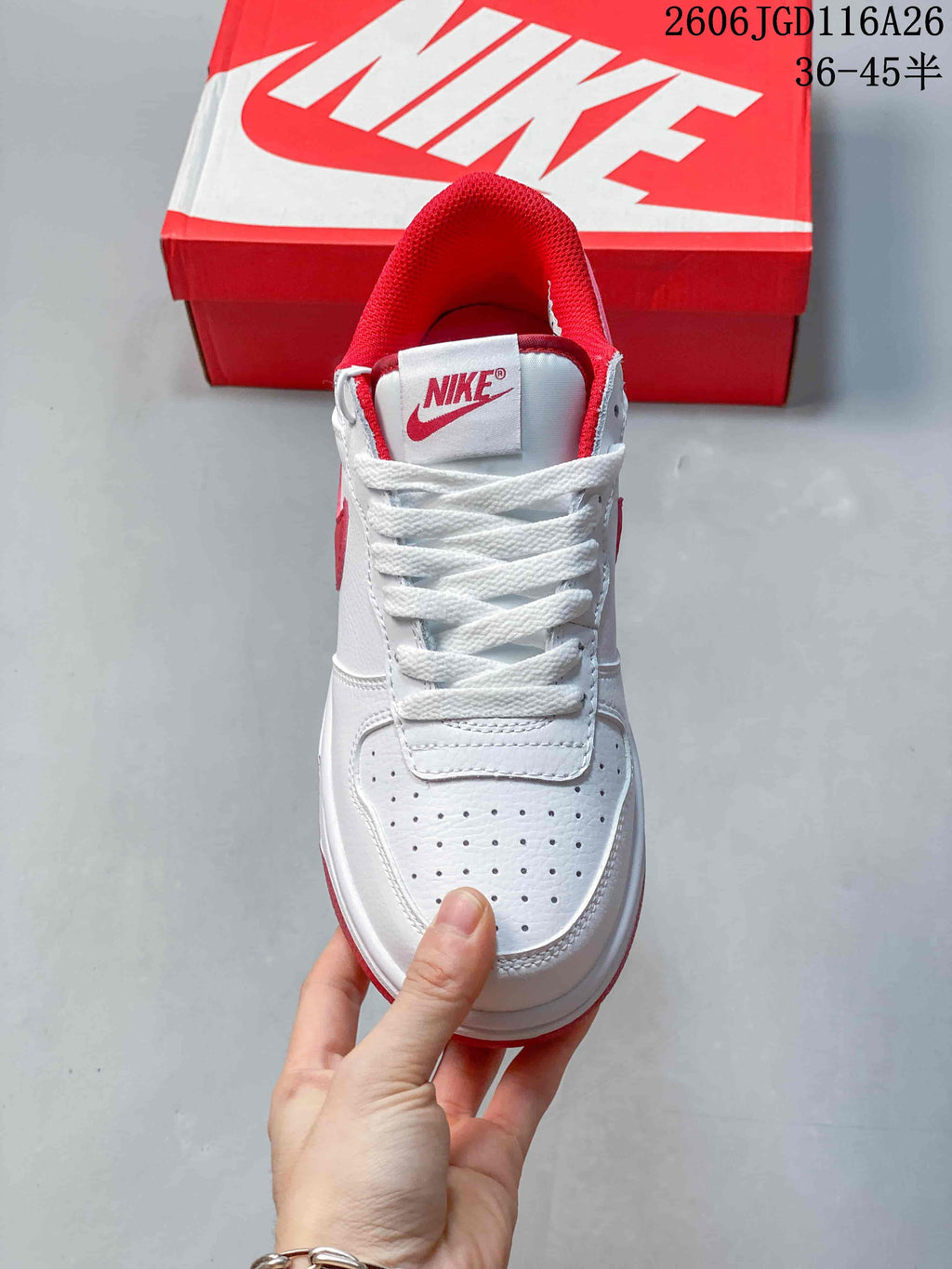 Front view of the sneaker showing white laces and a perforated toe