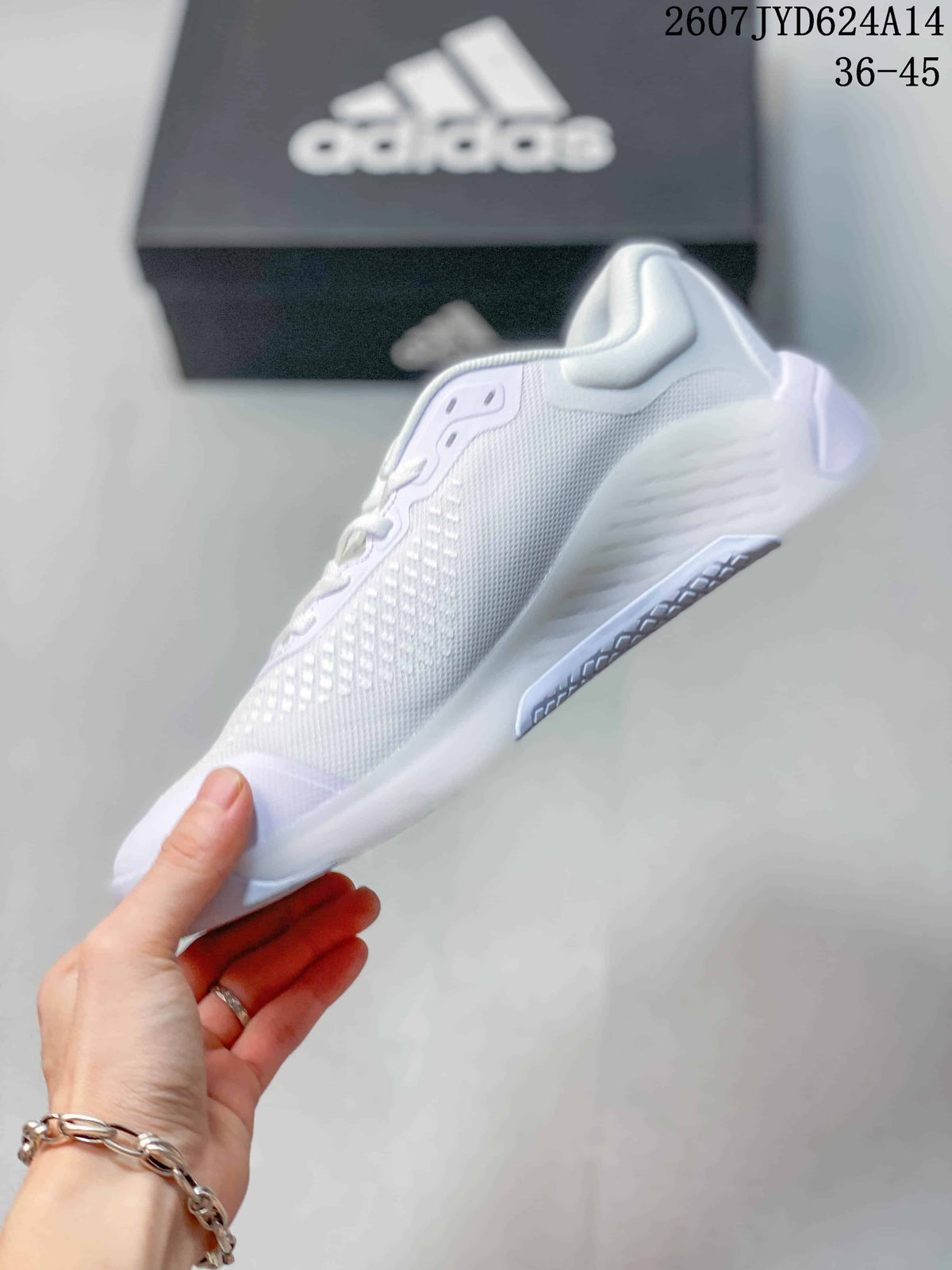 Side profile of a white low-top training shoe showing the mesh upper, lace area and outsole.