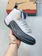 Angled side view of the white and dark gray high-top shoe.