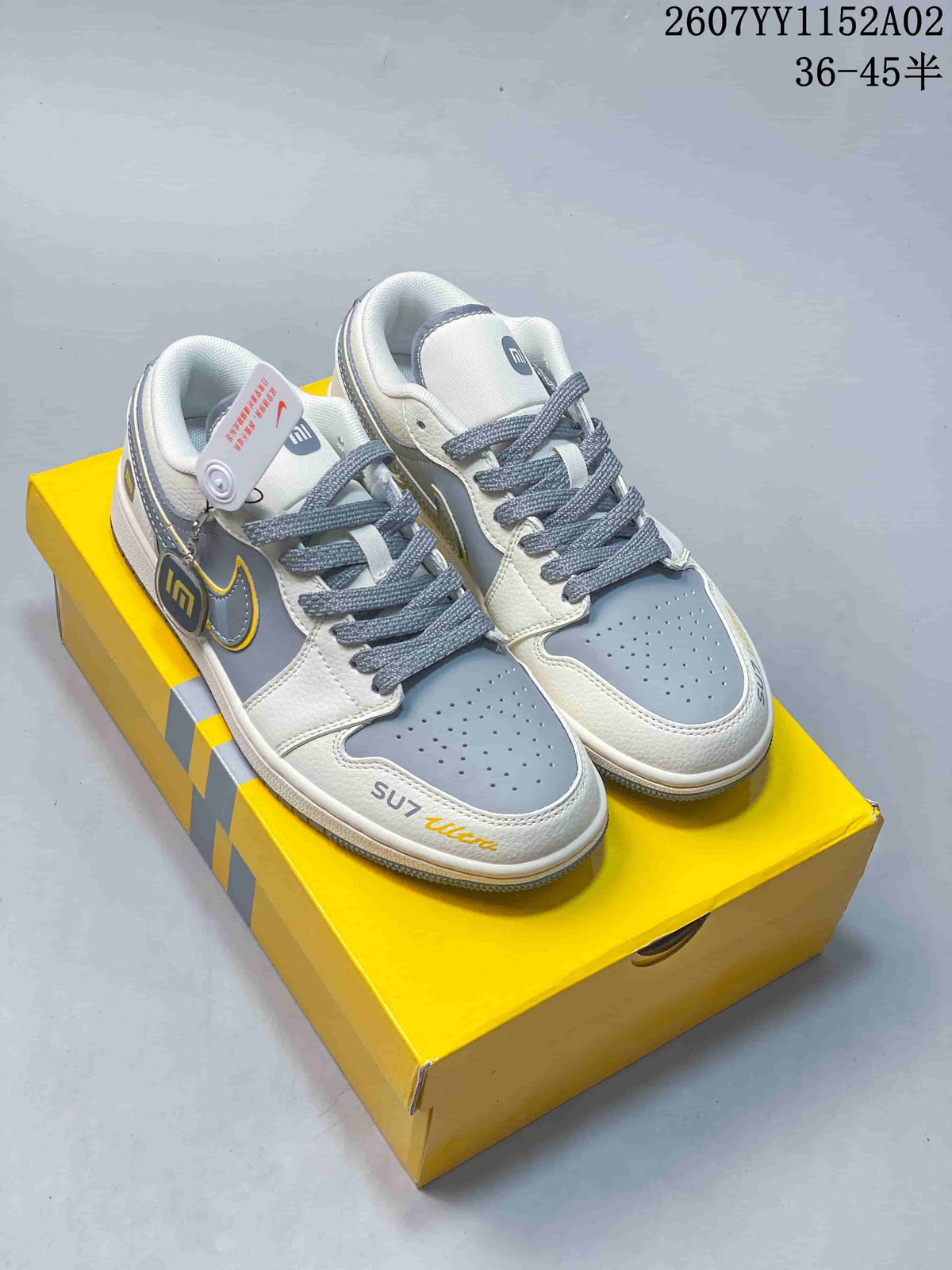 Pair of gray and white low-top sneakers with patterned gray laces