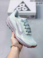 Side view of a pale mint Nike ACG Pegasus Trail sneaker showing the layered upper, laces, and sculpted sole.