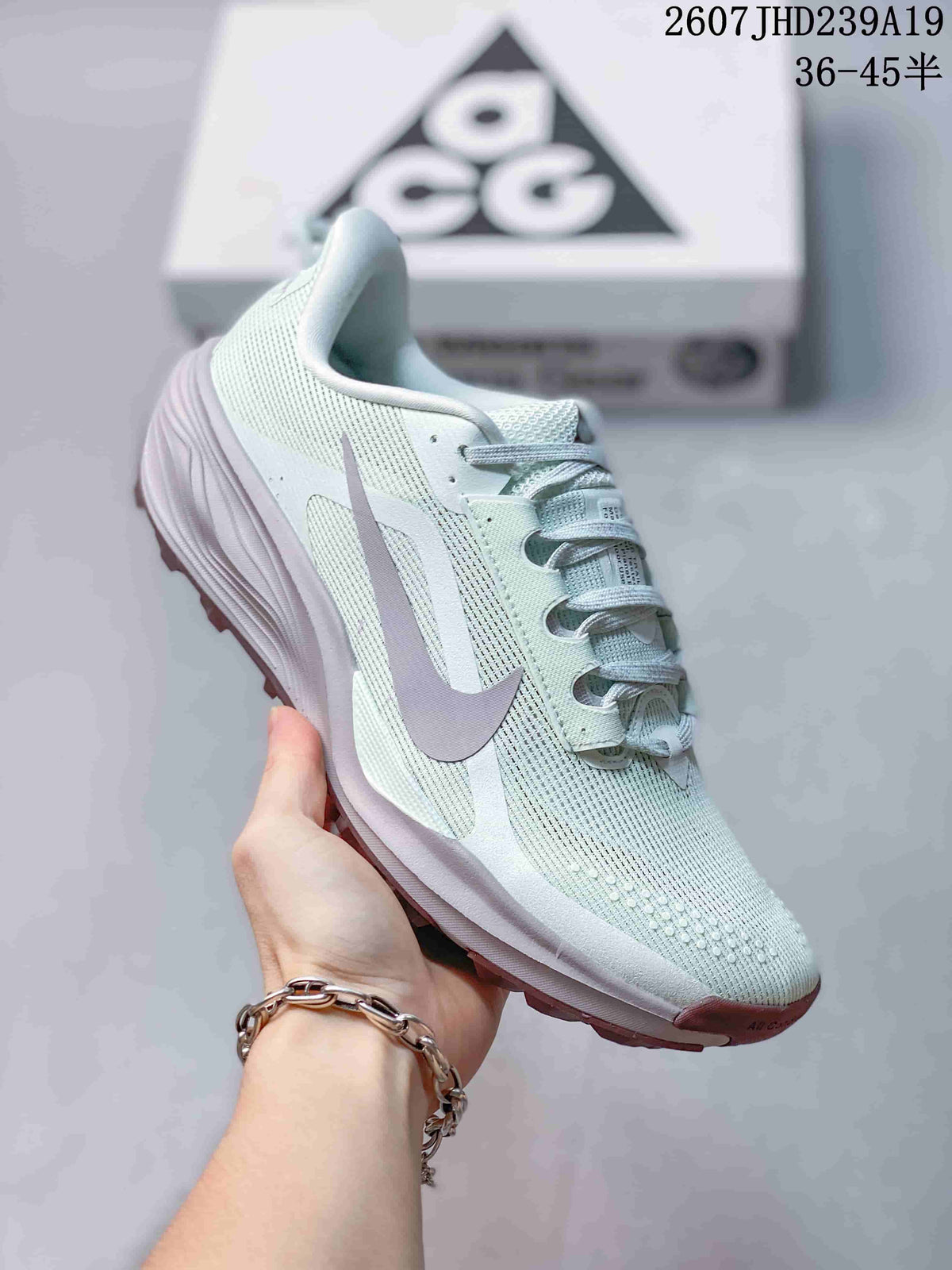 Side view of a pale mint Nike ACG Pegasus Trail sneaker showing the layered upper, laces, and sculpted sole.