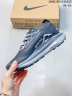 Side view showing GORE-TEX branding and the midsole on a Nike Pegasus Trail shoe