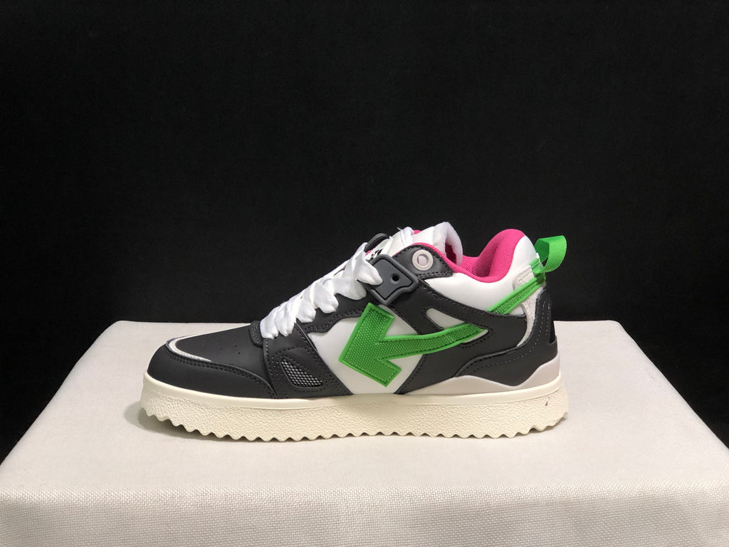 Side profile highlighting the green arrow motif, black overlays, white mid-panel and textured outsole.