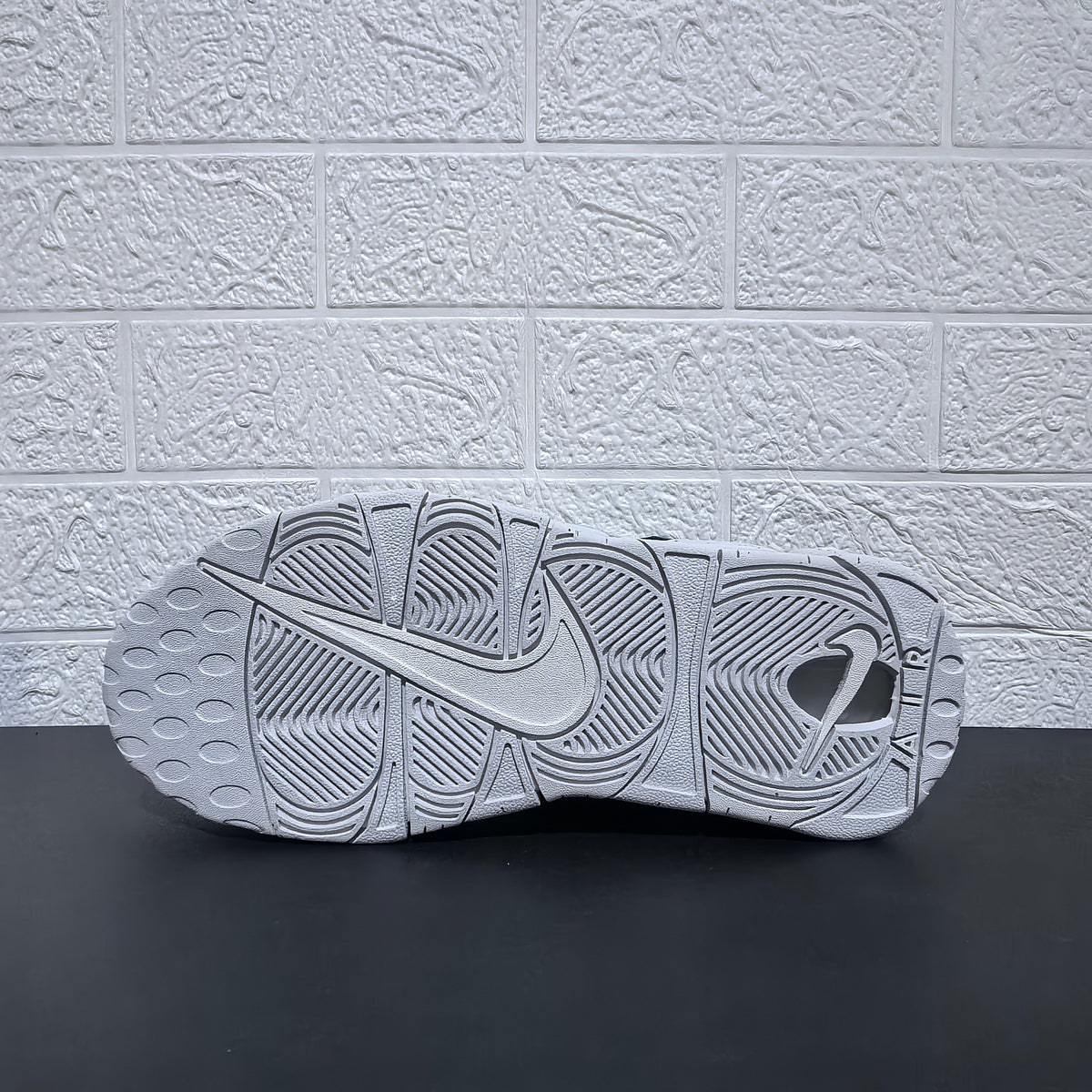 Underside view of the outsole with molded tread pattern