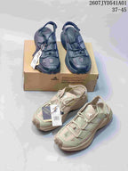 Dark navy and pale green adidas Terrex outdoor shoes shown together