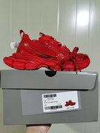 Full side profile of the red sneaker displayed on its box; the label shows model code 734731 W3XL1 6000, color RED, and size C 37.