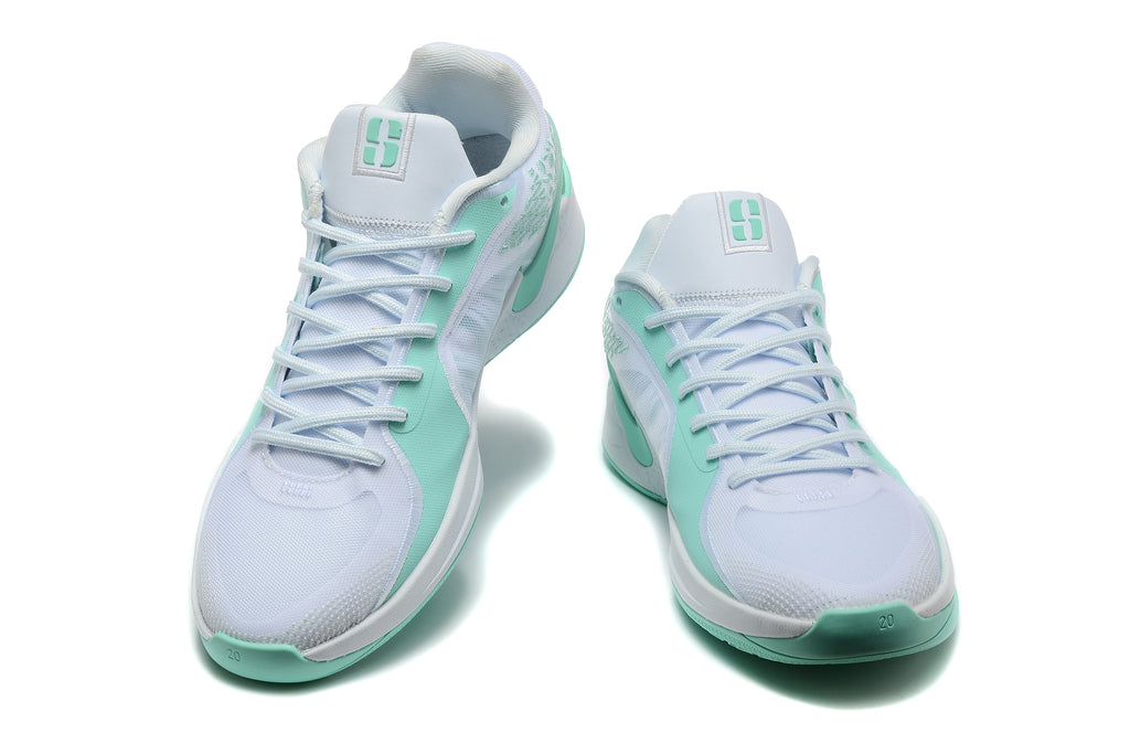 Pair of white and mint-green Nike Sabrina basketball shoes shown from the front