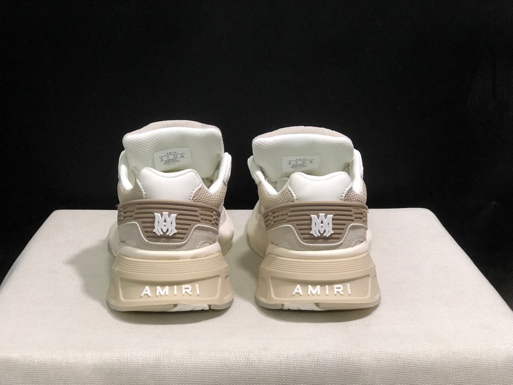 Rear view showing AMIRI branding on the heels and tonal heel detailing.