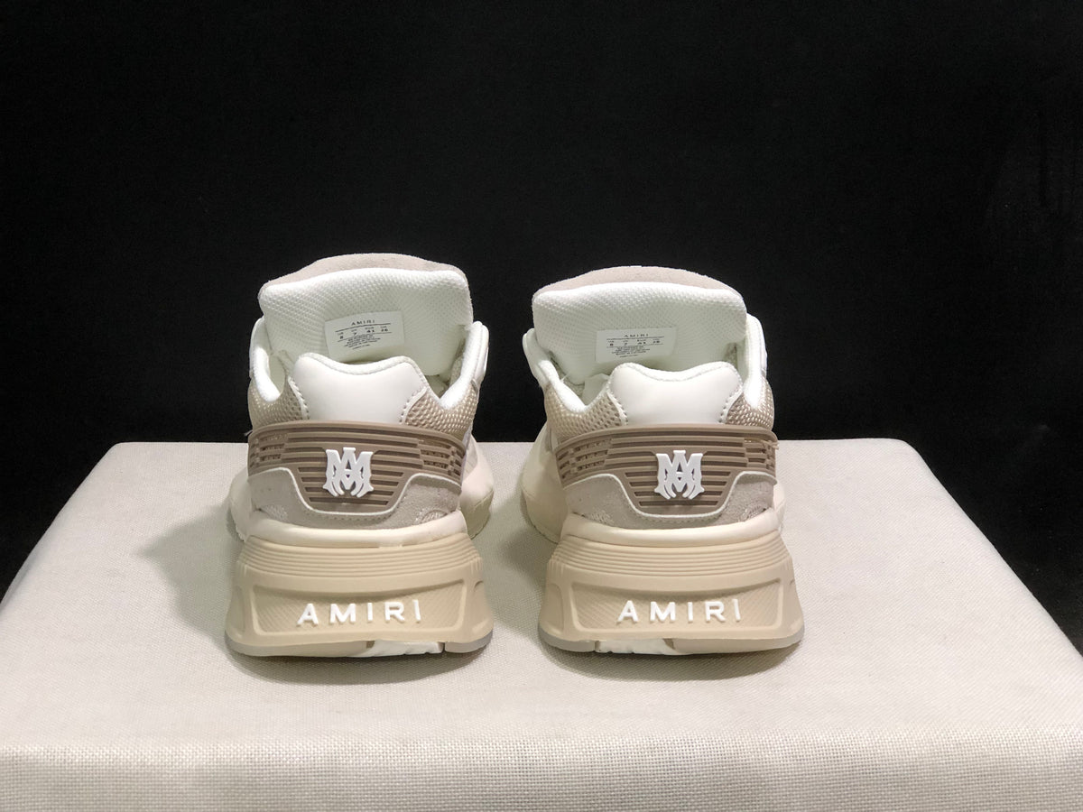 Rear view showing AMIRI branding on the heels and tonal heel detailing.