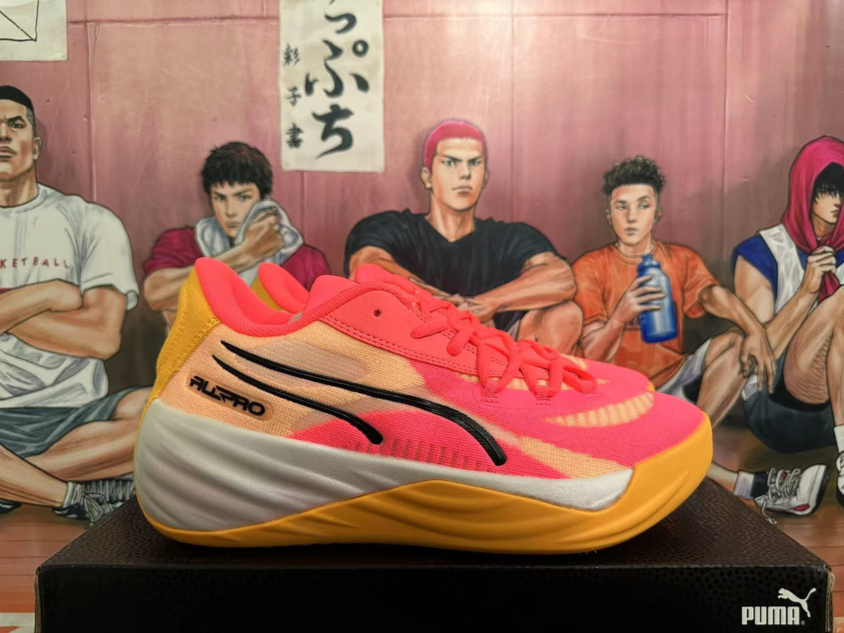 Side view showing the black PUMA stripe and All-Pro branding on a pink and gold shoe.