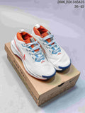 Pair of white Nike Pegasus Trail 5 GTX shoes with orange and blue accents on a Nike Trail box
