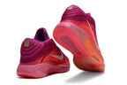 Pink and purple Nike GT Hustle 3 shoes shown from the heel and outsole.