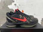 Side view showing the red Swoosh, camouflage upper, and sculpted heel of a Nike Kobe basketball shoe