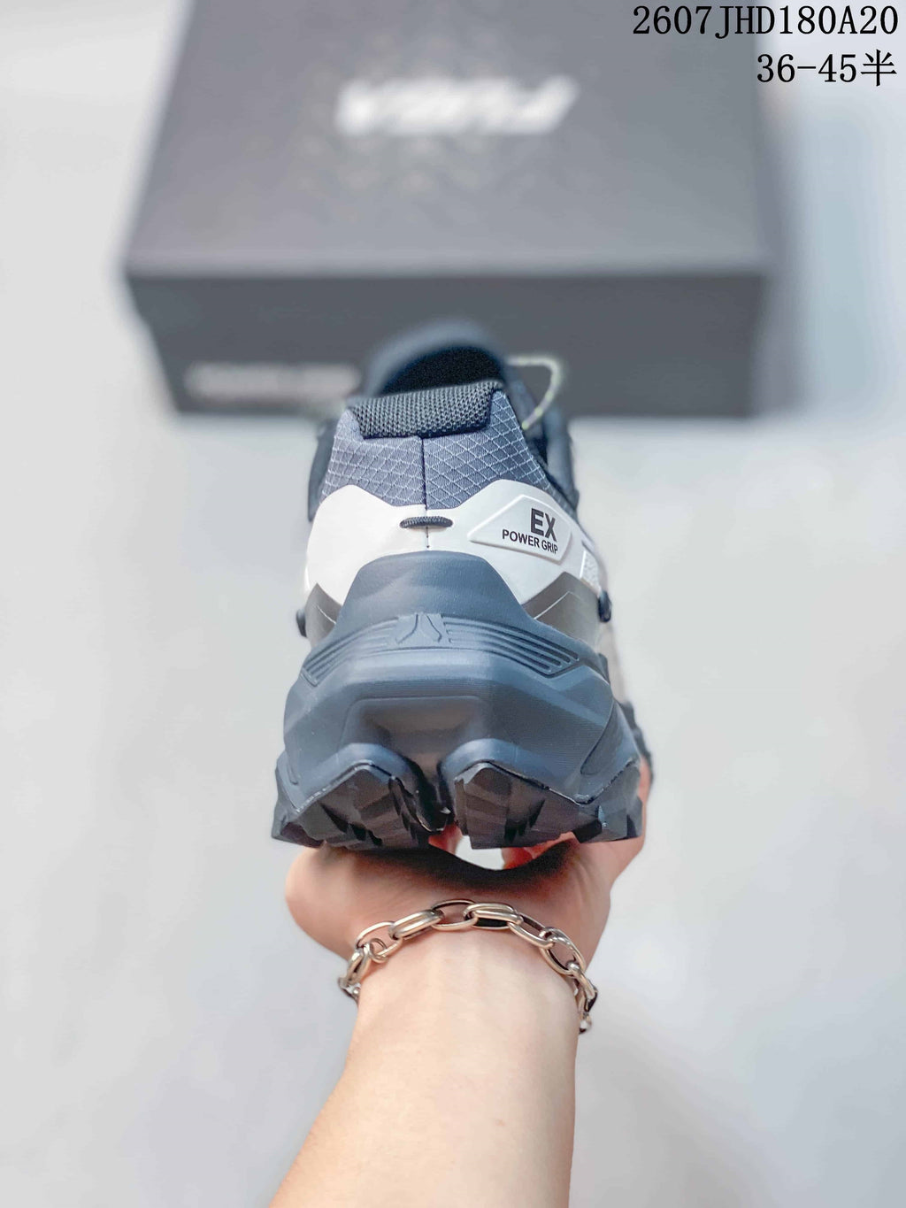 Rear view showing the structured heel counter, padded collar and deep outsole lugs.