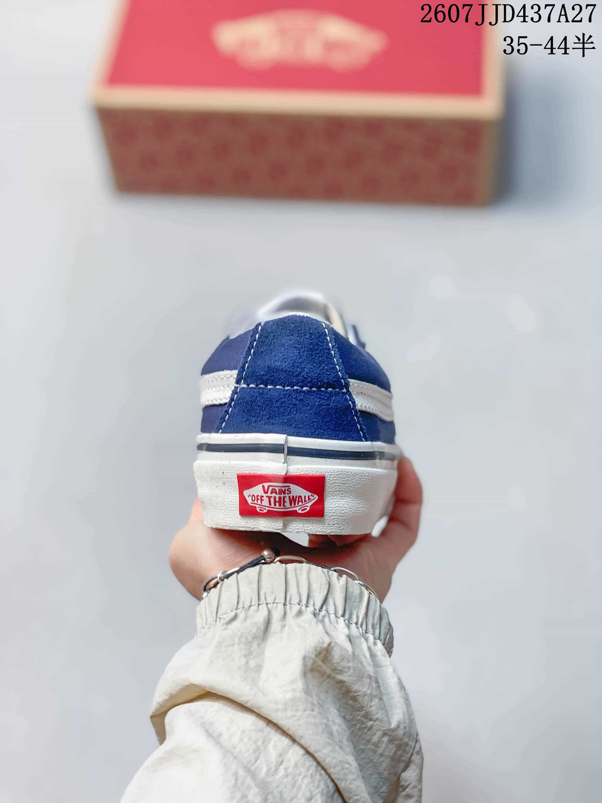 Rear view of the blue sneaker showing the white side stripe, layered sole, and Vans heel label.