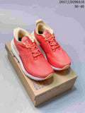 Pair of coral pink ASICS GEL-Nimbus 25 running shoes displayed on a shoebox, with cream collars, white midsoles and gum-colored outsole accents.