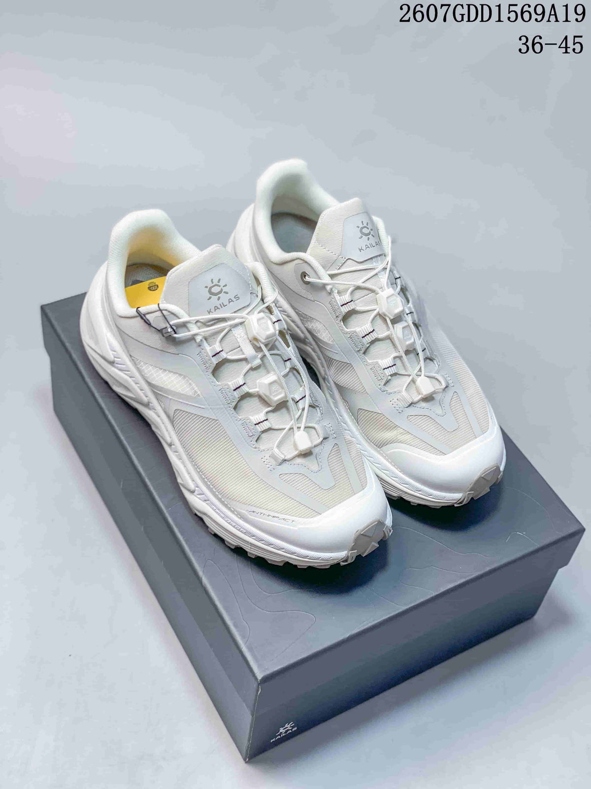 Pair of white KAILAS Shanxing 3 sneakers displayed on a box; overlay text shows style code 2607GDD1569A19 and size range 36–45.
