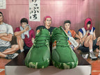 Front view showing green laces, perforated uppers, and patterned outsole edges.