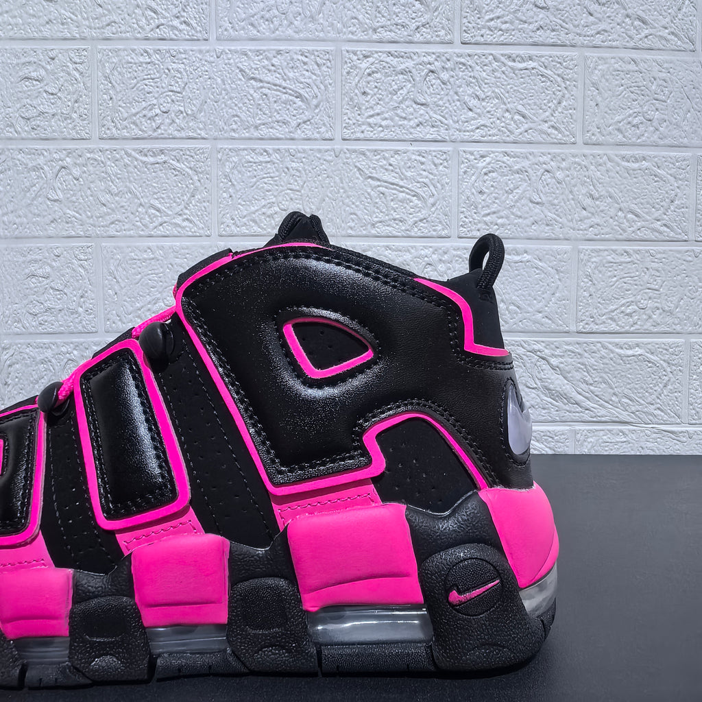 Close-up of the black and pink sneaker side panels