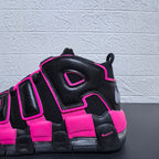 Close-up of the black and pink sneaker side panels