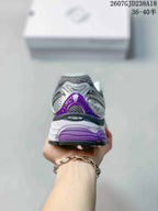 Rear view of a Saucony Progrid Omni 9 sneaker showing the purple heel detail and Progrid branding.