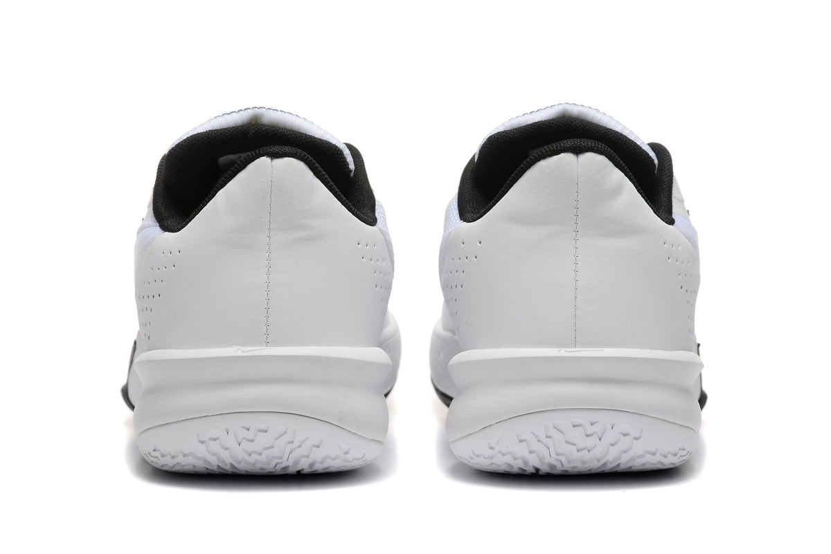 Rear view of the white Nike basketball shoes with black collars