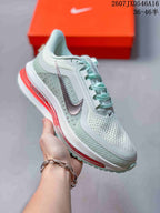 Angled side view showing the knit upper, large Nike Swoosh, mint outsole, and red cushioning details.